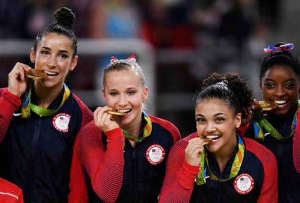 Zašto Olimpijci grizu svoje medalje?